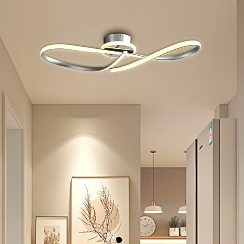 LED-Deckenleuchte mit gekreuzten Leuchtleisten und runder Metallbasis