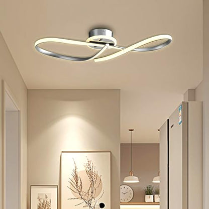 LED-Deckenleuchte mit gekreuzten Leuchtleisten und runder Metallbasis