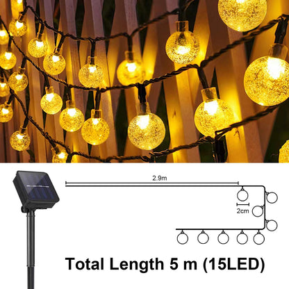 Solar-Lichterkette mit goldenen Glaskugeln und Solarpanel, warmweiß, Kabelschlaufe
