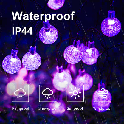 Solar-Lichterkette IP44 mit violetten Glaskugel-LEDs und wetterfesten Schutzsymbolen