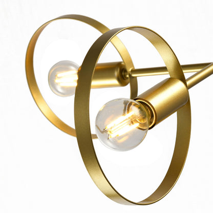 Nahansicht der goldfarbenen Pendelleuchte mit zwei runden Ringen und zwei sichtbaren Glühfäden