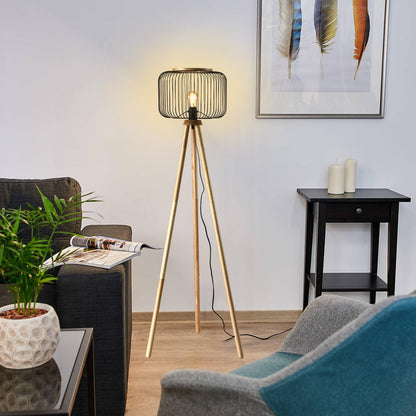 Stehlampe mit zylindrischem Drahtschirm, warmem Licht und Holz-Dreibeinstativ