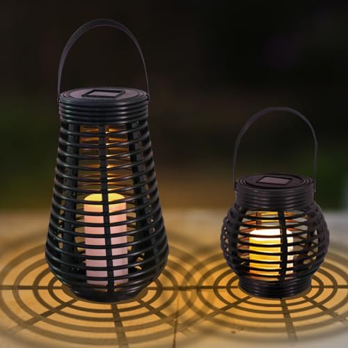 Solarlaternen mit Tragebügeln, warmweiß beleuchtet, schwarzes lamellenartiges Gehäuse